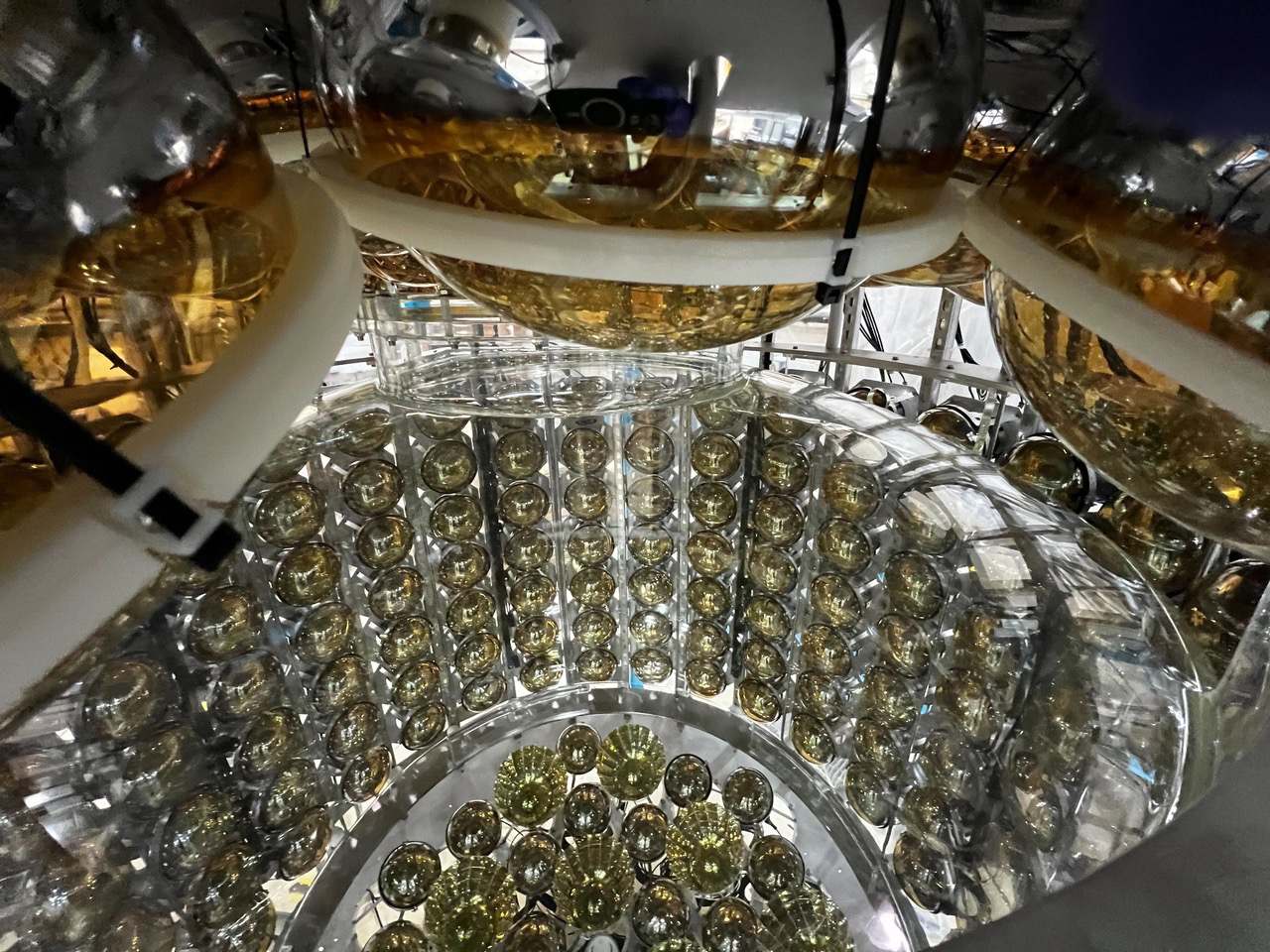 banks of shiny yellow glass globes covering photomultiplier tubes