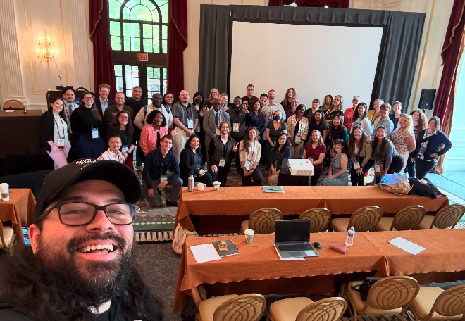 Dozens of people pose for a selfie at an anti-hunger conference in Washington, D.C.
