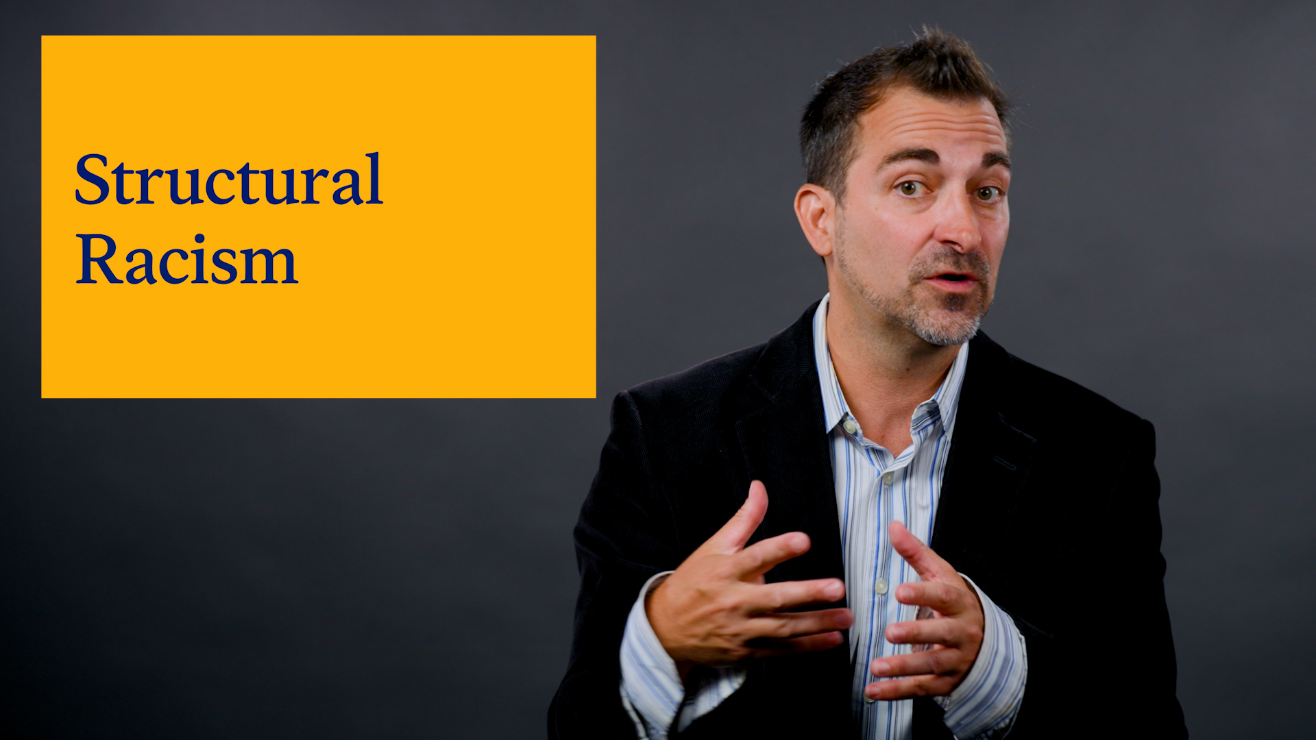 Researcher Stephen Menendian is shown in studio with inset image reading structural racism